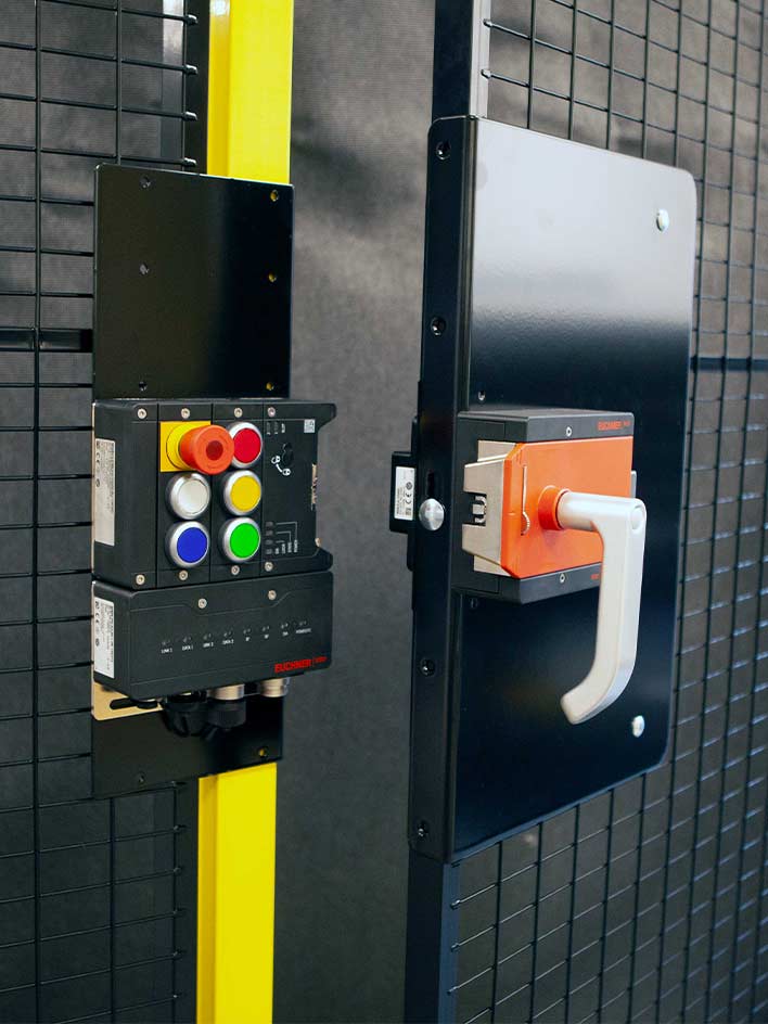 A close-up of an industrial guard locking system with a secure handle and integrated control panel. The image highlights the critical role of guard locking in ensuring machine safety, preventing unauthorized access, and protecting workers from hazardous machinery.