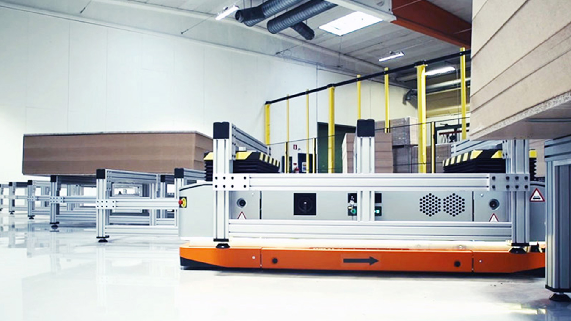 Autonomous Mobile Robot (AMR) transporting goods through an industrial warehouse